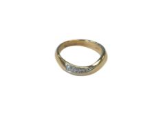 A 9ct yellow gold fancy diamond twist band ring, size M.