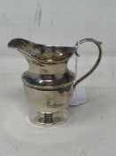 A small silver cream jug, Birmingham 1919 66.2g, height 8 cm.