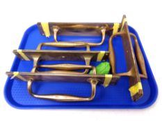 A tray of brass door handles