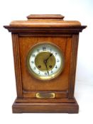 An oak presentation mantel clock of military interest with plaque inscribed 'Presented to Lance