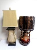 A 20th century studio pottery table lamp with metal shade together with a further table with shade