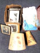 A vintage case containing 20th century linen, lamp shades,