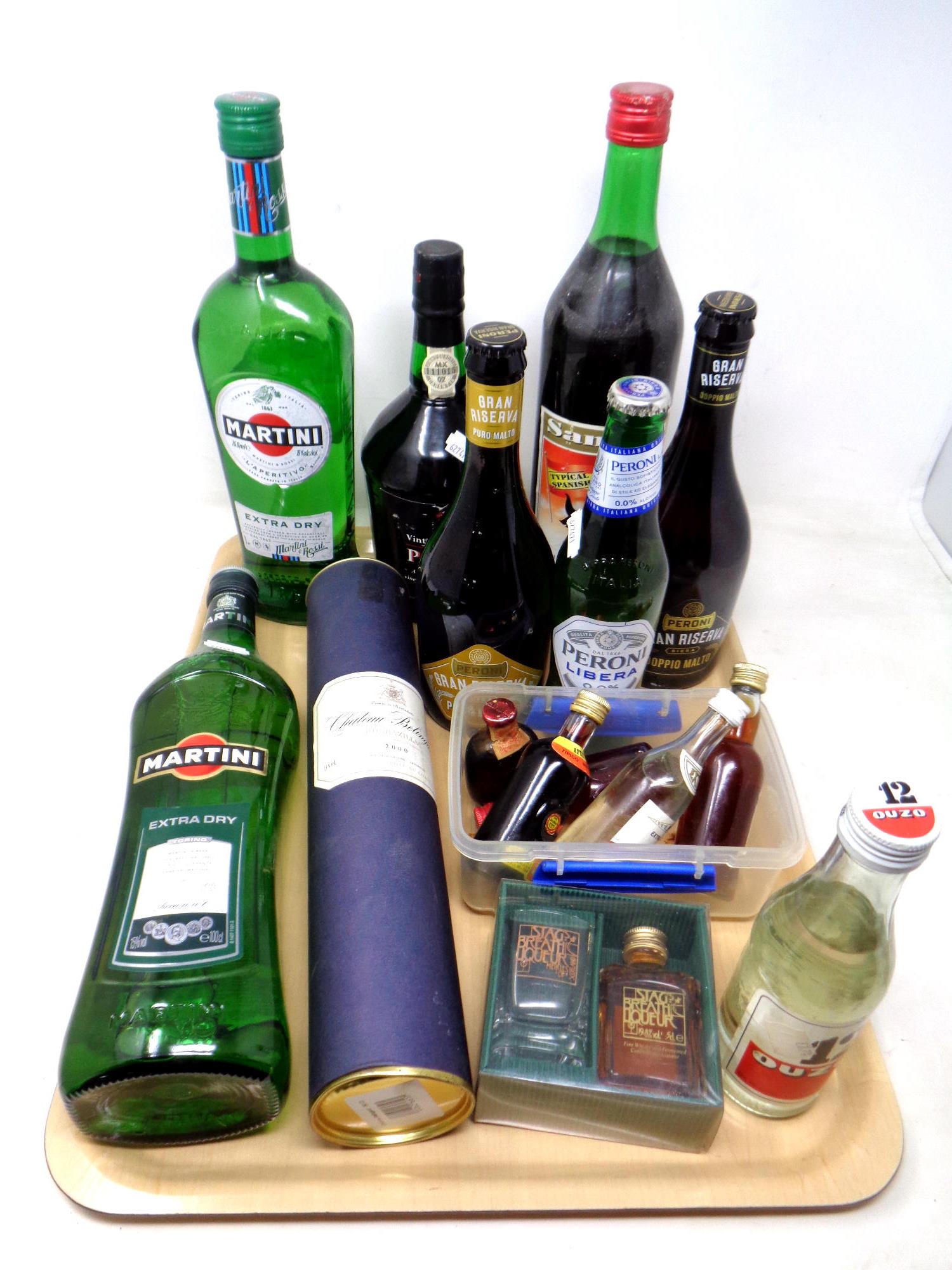 A tray of alcohol including Martini, Ouzo, vintage character port,