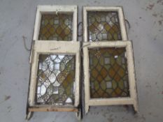 Four antique stained glass windows