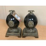 An ornate pair of contemporary bookends, classical in style with "Fleur-de-Lis" decoration,