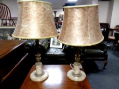 A pair of decorative brass and marble table lamps with shades