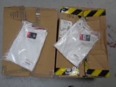 Two boxes of Dickies medical white uniforms