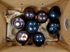 A box of two sets of four bowls, one marked Greenmaster 3-Heavy, the other marked Thomas Taylor,
