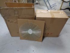 Two boxes of sunburst wall mirrors