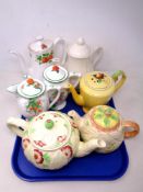 A tray of seven tea pots and jugs including Burlington,