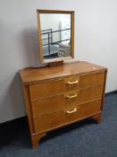 A 20th century teak three drawer dressing chest