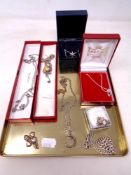 A tray of silver jewellery, curb link chain, charm bracelet, necklace, pendant etc.