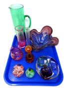 A tray of late 20th century coloured glass, paperweights, bud vase,