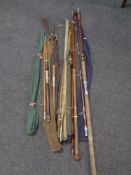 A bundle of early 20th century and later fishing rods