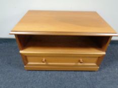 A teak entertainment stand