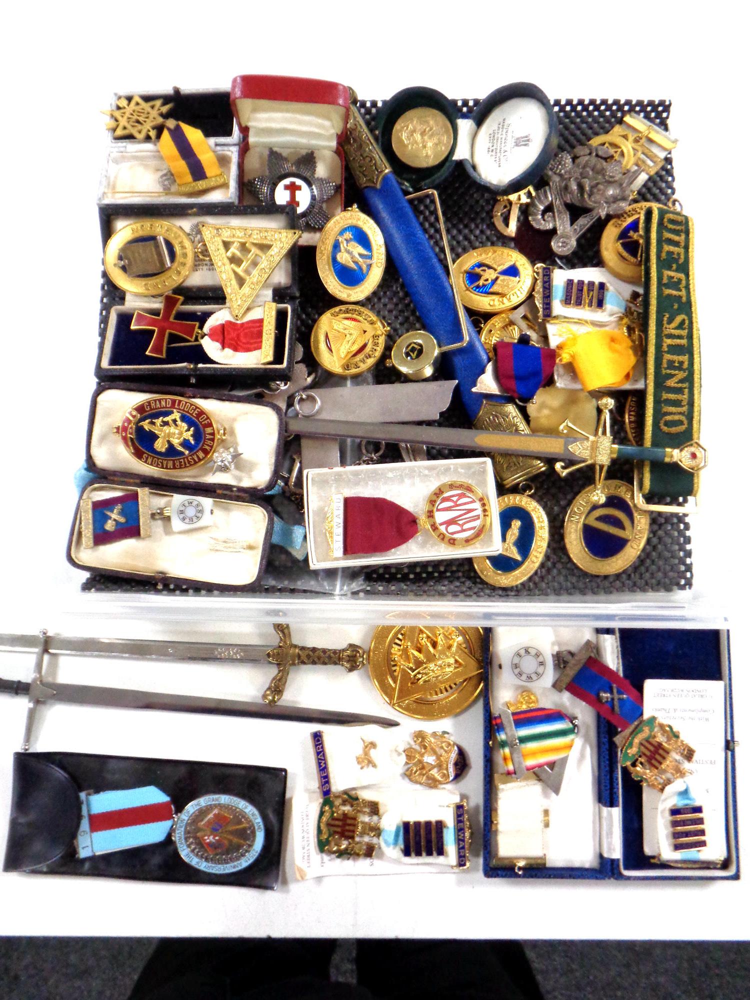A box of Masonic related items including medals, miniature swords,
