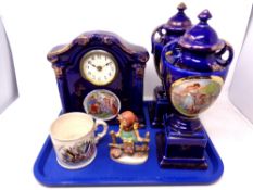 A tray of transfer printed three piece clock garniture set, Devon fieldings mug,