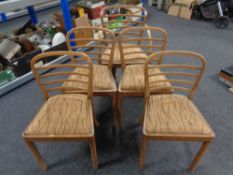 A set of five mid century beech framed dining chairs