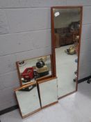 Four teak framed wall mirrors