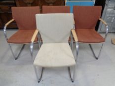 Four metal framed office armchairs