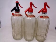 Three vintage Muters Soda Water siphons, bearing writing Muters High Class Mineral Waters,