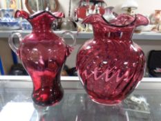 A Royal Scot cranberry glass twin-handled vase together with a further cranberry glass vase