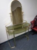 A contemporary brass and glass dressing table with mirror