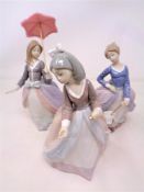 Three Lladro figures of girls CONDITION REPORT: One figure lacks parasol