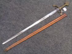 A Medieval style sword in leather scabbard