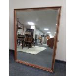 An overmantel mirror 130cm by 100cm.