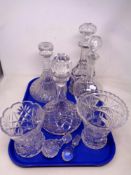 A tray of four cut glass decanters with stoppers,