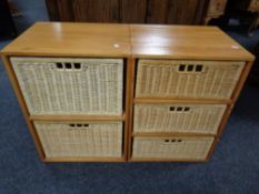 A pair of pine and wicker drawer chests