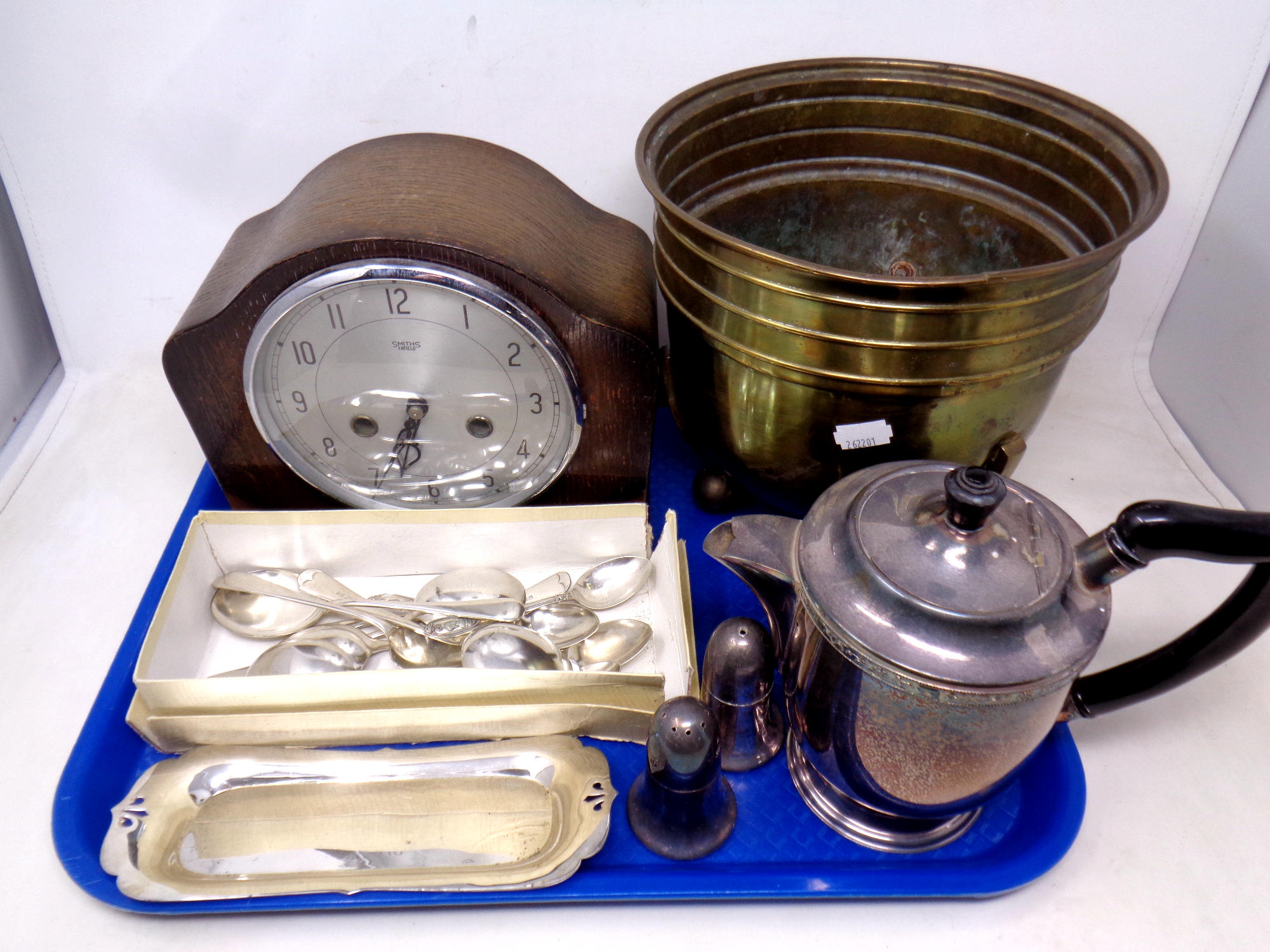 A tray of EPNS tea pot and pair of sifters, Smiths mantel clock, cutlery,