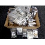 A box of unboxed 1:72 scale modelling kits, including AH-64 Apache helicopter,