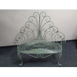 A wrought iron Art Deco style garden bench 118cm wide by 65cm deep by 115cm high.