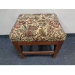 An antique pine tapestry footstool