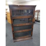 An Edwardian oak four-tier stacking bookcase