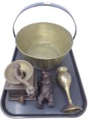 A tray of brass jam pan, coffee grinder, metal bear money box,