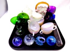 A tray containing silver lidded glass scent bottle, glass paperweights including Caithness,