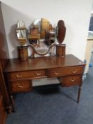 A 20th century Strongbow Furniture mahogany four-drawer dressing table with triple mirror