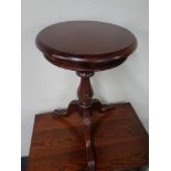 A Victorian style pedestal wine table