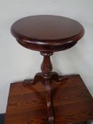 A Victorian style pedestal wine table