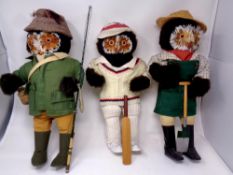 A set of three character owl figures : Cricketer, gardener and fisherman,
