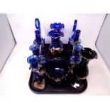 A tray of blue and gilt glass ware including candlesticks,
