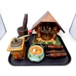 A tray of cuckoo clock, wood mortar and pestle, coffee grinder,