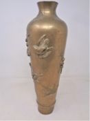 A Chinese embossed brass vase, height 36 cm,