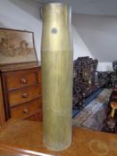 A brass ammunition shell,