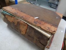 A 19th century leather bound family bible with black and white book plates
