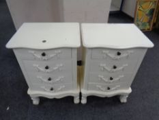A pair of French style four-drawer bedside chests