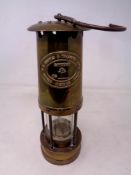 A brass E Thomas and Williams miner's lamp